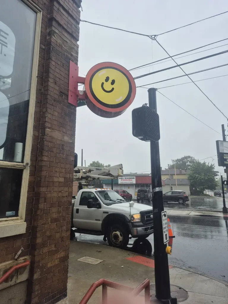 Circular smiley storefront sign in Columbus, Ohio